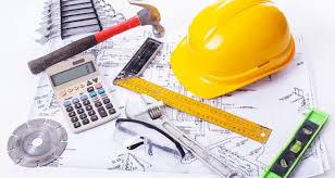 Blueprints with hard hat, spirit level, folding ruler, and hand tools for thickness design
